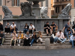 Tourists in Trastevere outside Basilica of Santa Maria